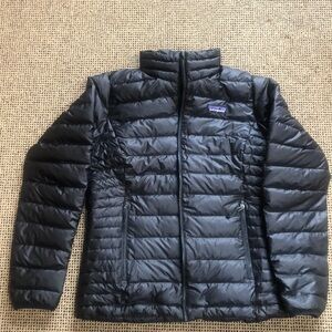 Woman’s Patagonia black small down zip front jacket.